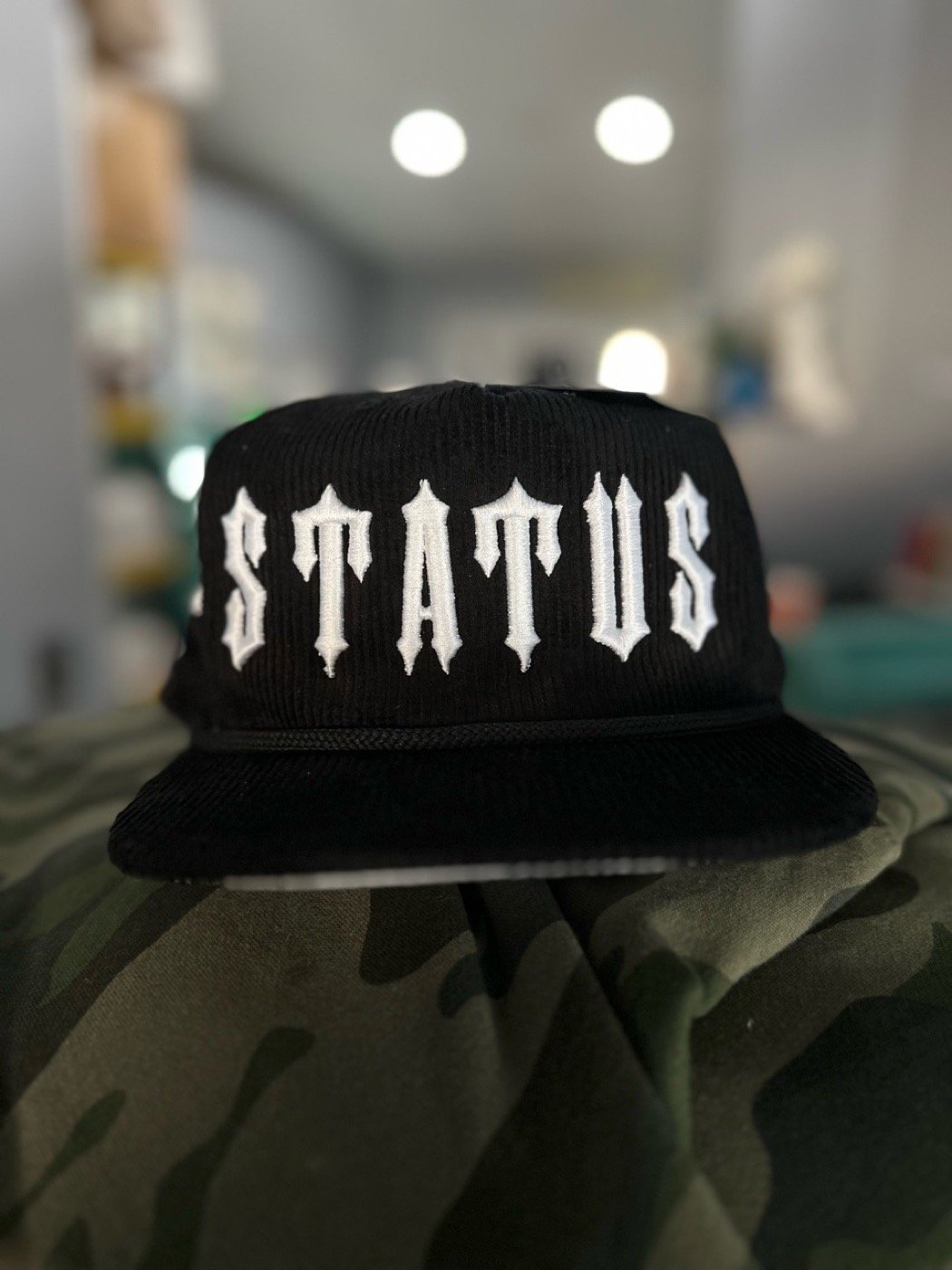 Embroidered black corduroy STATUS snapback hat